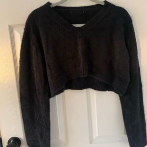 Tiny black cropped sweater. Fluffy material.